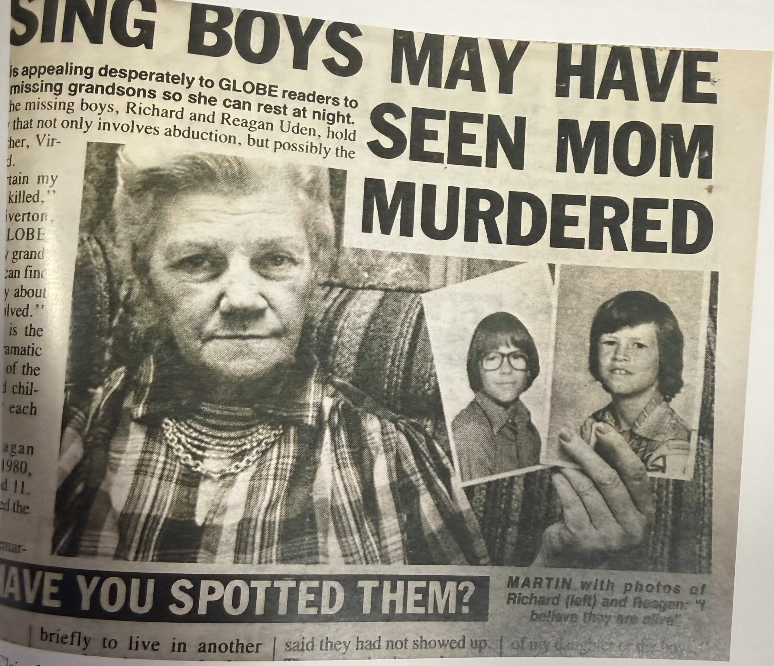 Claire Martin holding photographs of Richard and Reagan Uden in a Globe newspaper appeal
