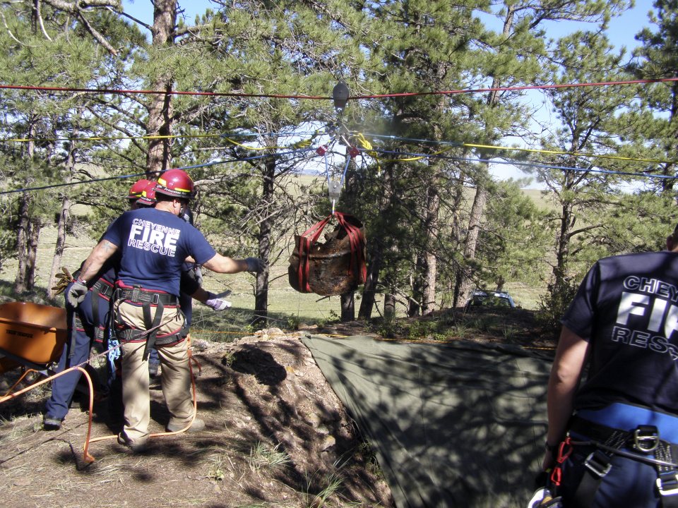 Cheyenne Fire Rescue crews raising the barrel containing Ronald Holtz's remains from the mine shaft in 2013