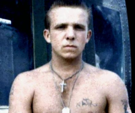 Ronald Holtz in Vietnam, in front of a helicopter